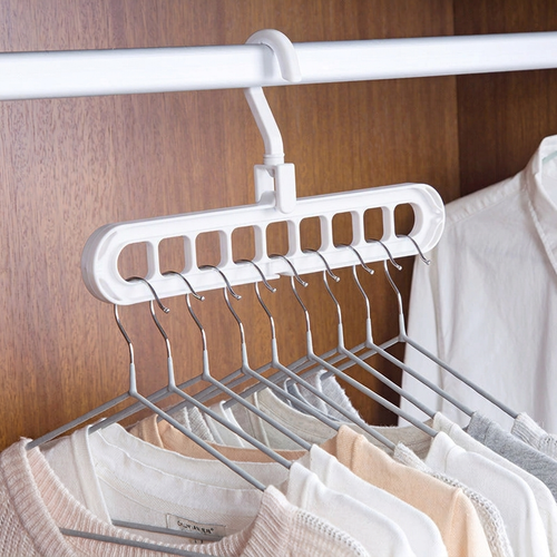 9-Hole Folding Clothes Hanger Organizer, hanger stacker, closet organizer and clothes hanger holder — Color White in a home setting. [variant-scope]